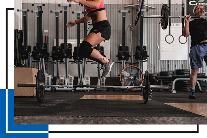 Woman jumps doing crossfit