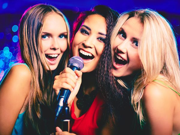 ladies singing karaoke
