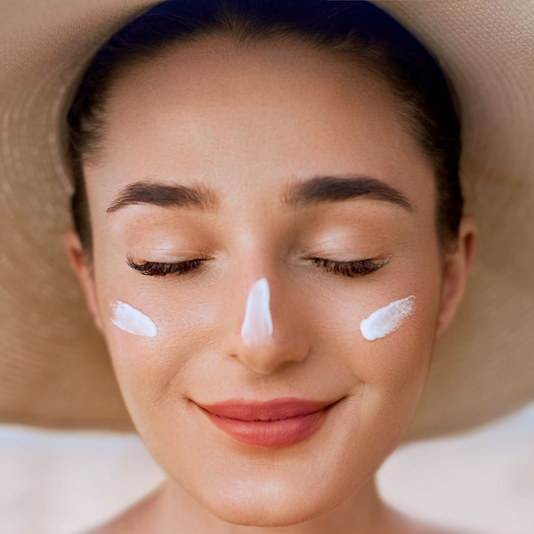 woman with sun protectant on her face