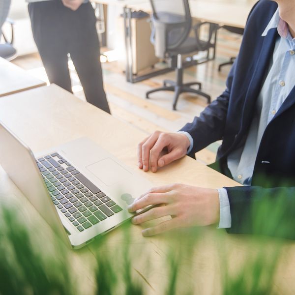 Hands on a laptop