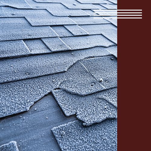 Image of a roof with broken shingles