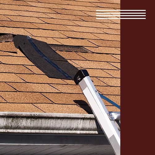 Image of a roof with broken shingles