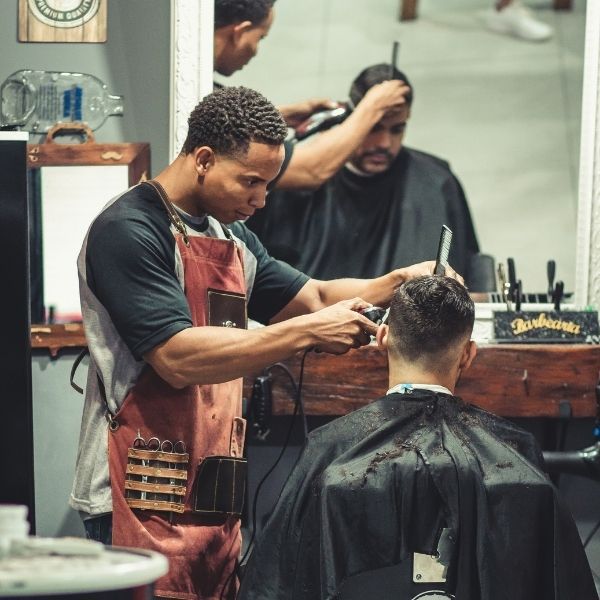barber cutting a man's hair
