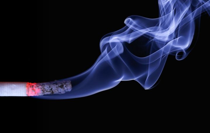 Cigarette with Cigarette Smoke - Cigarette smoking affects healing