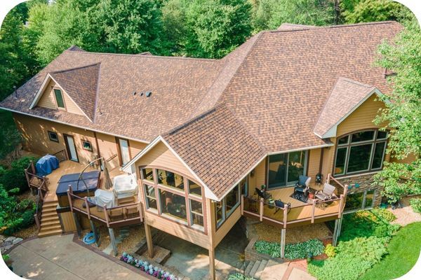 a home with a clean roof in a forest Roof Cleaning (3).jpg