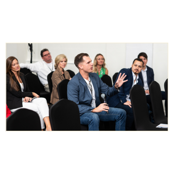 man in audience with microphone