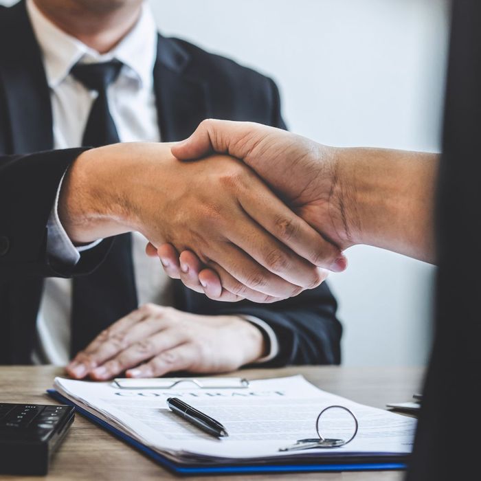 Two people shaking hands. 