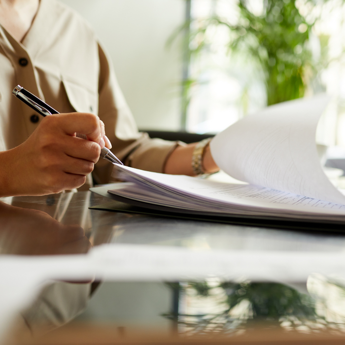 person filling out paper work