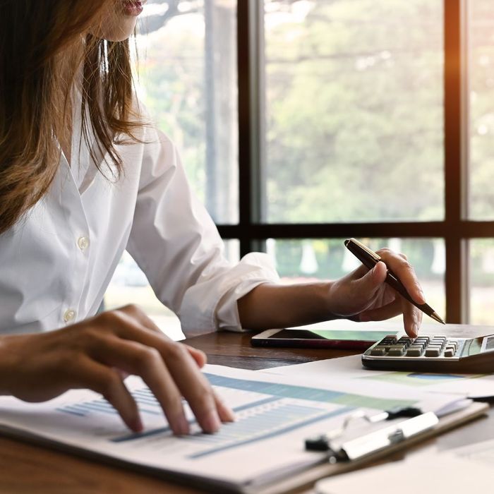 woman looking at clipboard