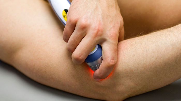 close-up of cold laser therapy on elbow