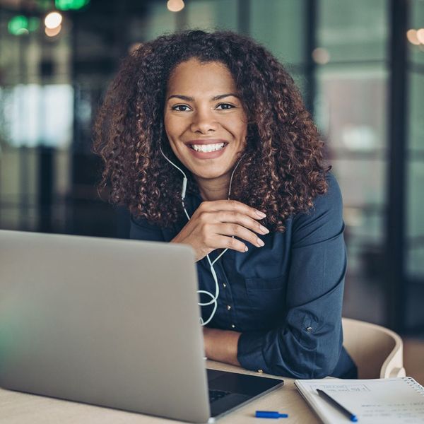 female coach on laptop