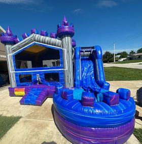 Castle bounce house with waterslide into a pool  $169
