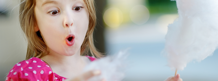 child with cotton candy