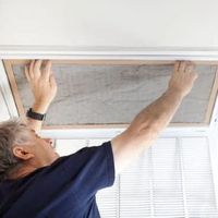 Person changing HVAC filter