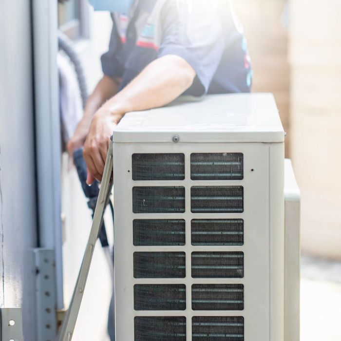 Technician working on an HVAC unit