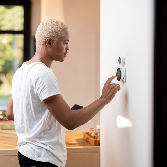 Man changing thermostat