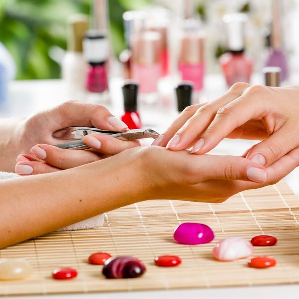 woman trimming her cuticles