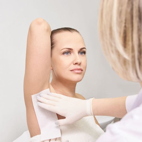 waxing a woman's underarm