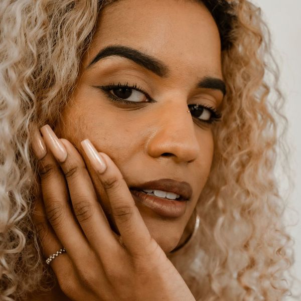 happy, confident woman with freshly done nails happy, confident woman with freshly done nails