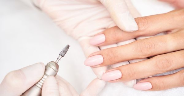 professional performing a manicure