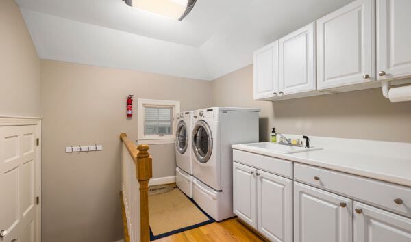 laundry room with cabinets