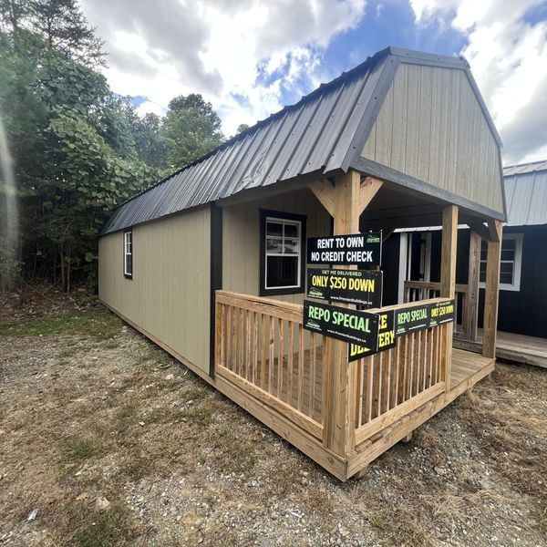 a barn with a rent to own sign on it