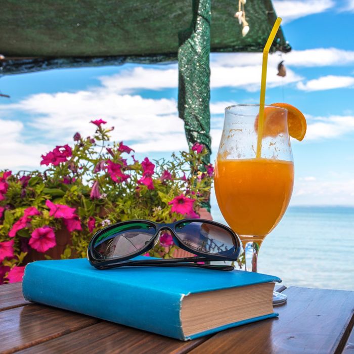 drink and books near beach