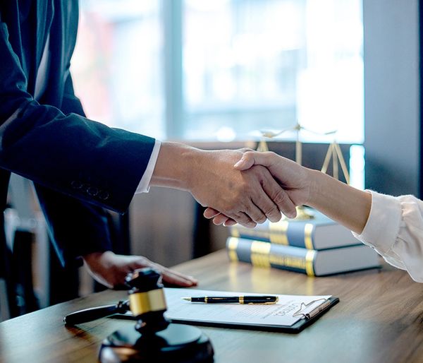 Lawyer shaking hands with a client