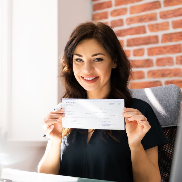 image of a woman getting a paycheck