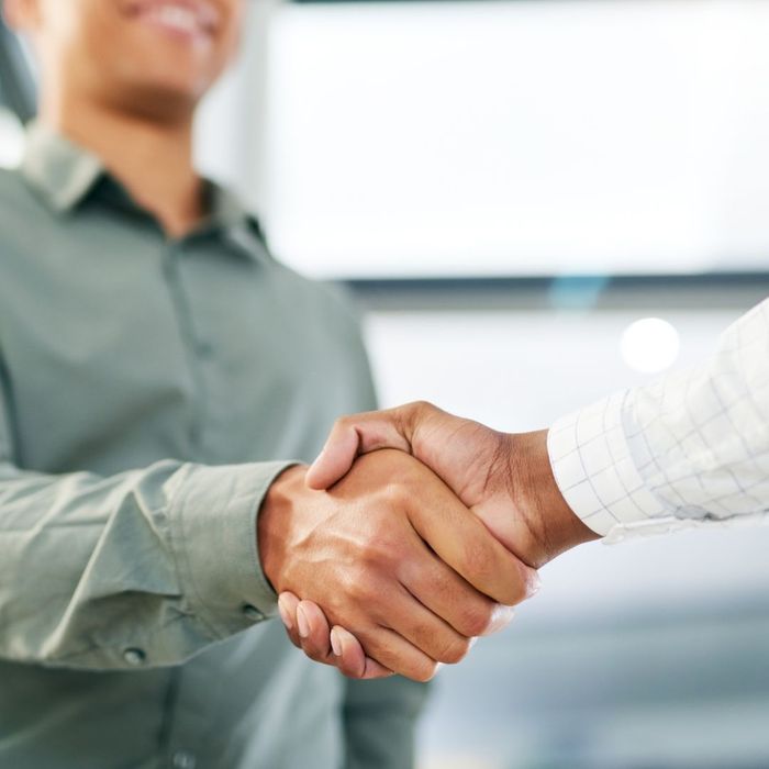 new hire shaking employer's hand
