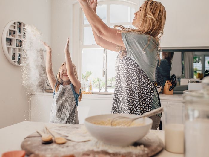 A mother and daughter having fun baking together A mother and daughter having fun baking together