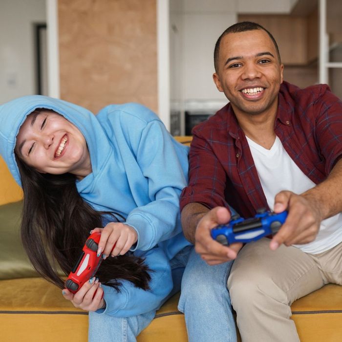 two friends playing playstation