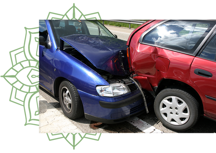 Image of two damaged cars smashed together on the street