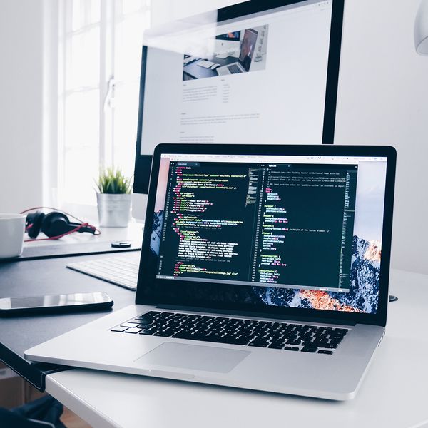 A laptop on a table working from a virtual desktop.