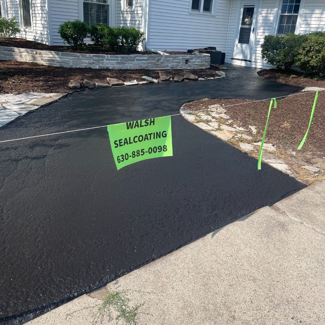 A small driveway that has been sealcoated