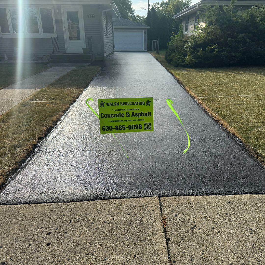 sealed driveway with a rope across it so people won't drive on it sealed driveway with a rope across it so people won't drive on it