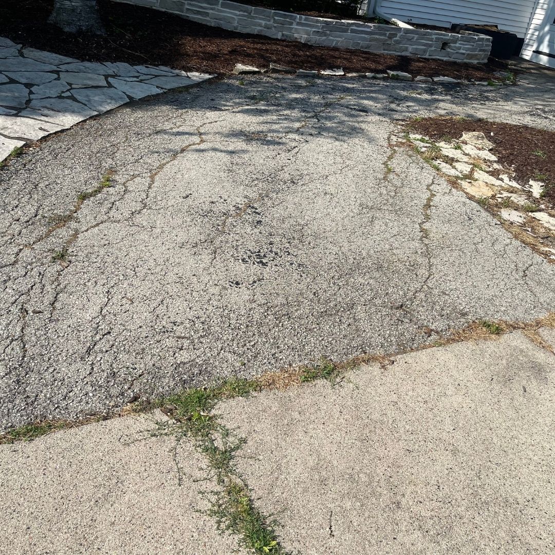 Cracking asphalt on driveway