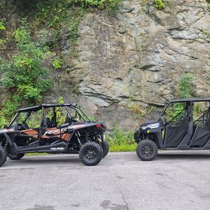 Two rental UTVs parked close to each other