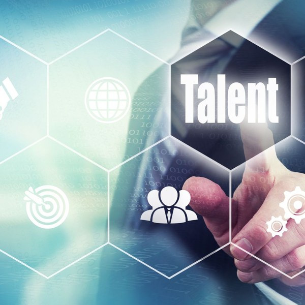 Person pointing toward the word "talent" in a graphic.