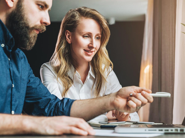 Man and woman looking at a laptop Man and woman looking at a laptop