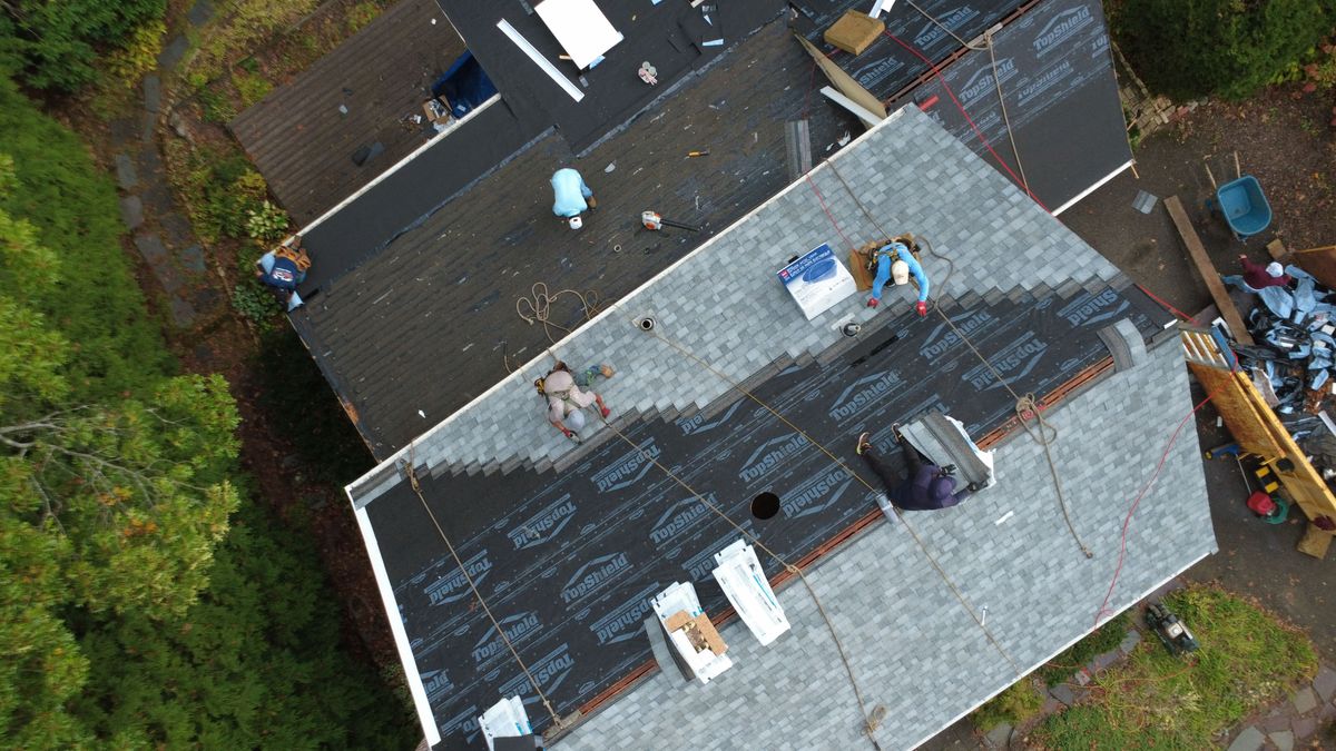 Roofing in progress in Wellesley MA