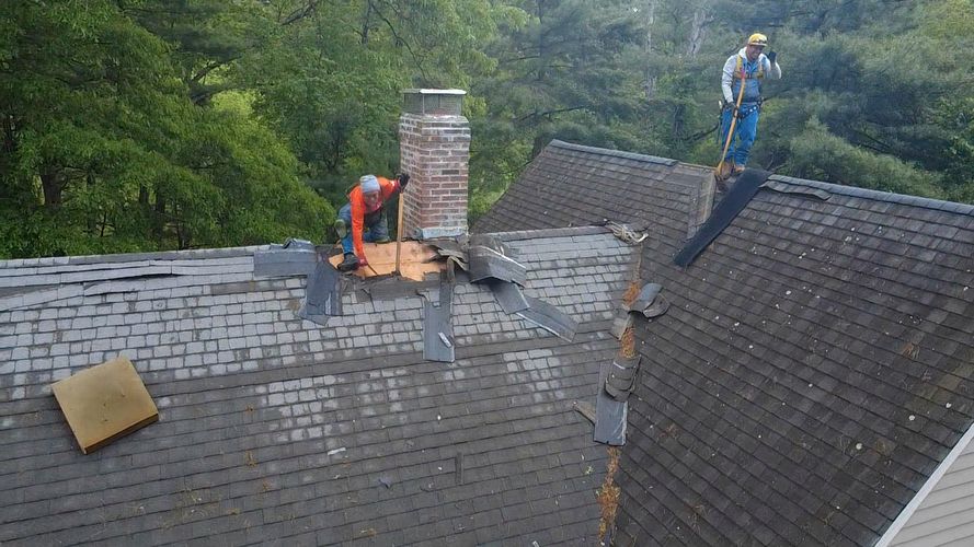 Roof shingle removal during roof replacement in Walpole MA