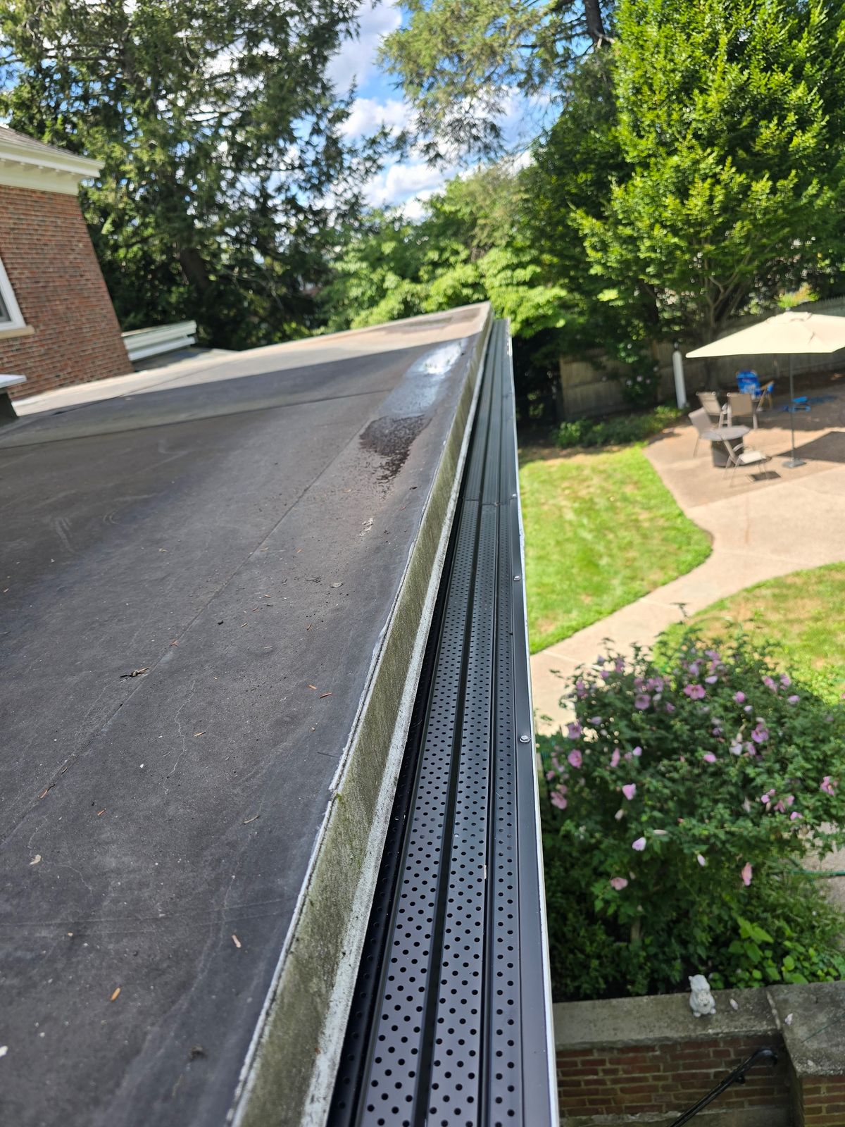 Newton Centre - Full gutter tune-up and installed micro-mesh Leaf Guards at 405 Commonwealth Ave in Newton, MA.