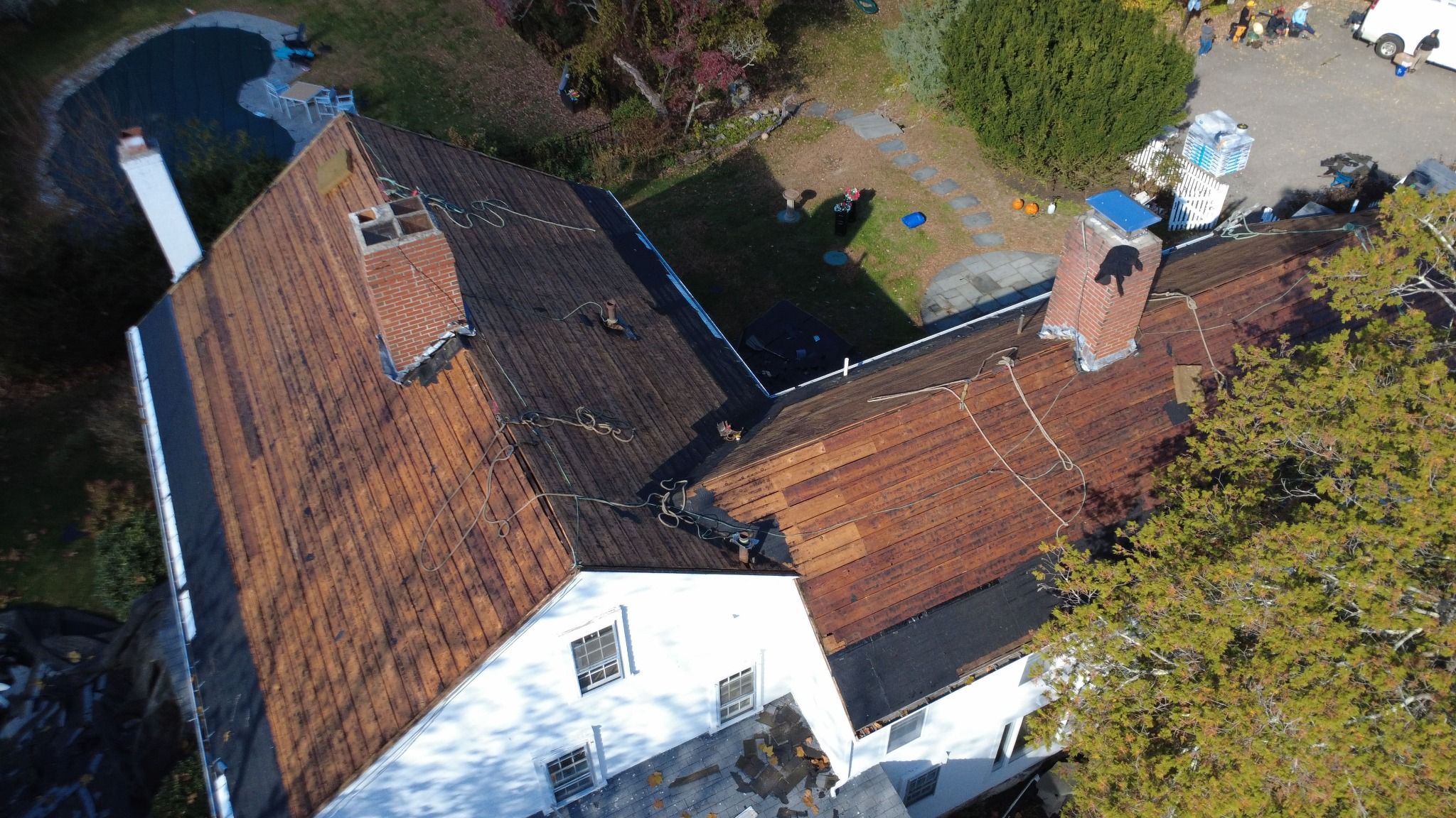 Overhead view of Natarelli & Son Roofing and Gutters on a residential roof on a 18th-century historic property in Norfolk, MA Natarelli & Son Roofing and Gutters on a residential roof on a 18th-century historic property in Norfolk, MA