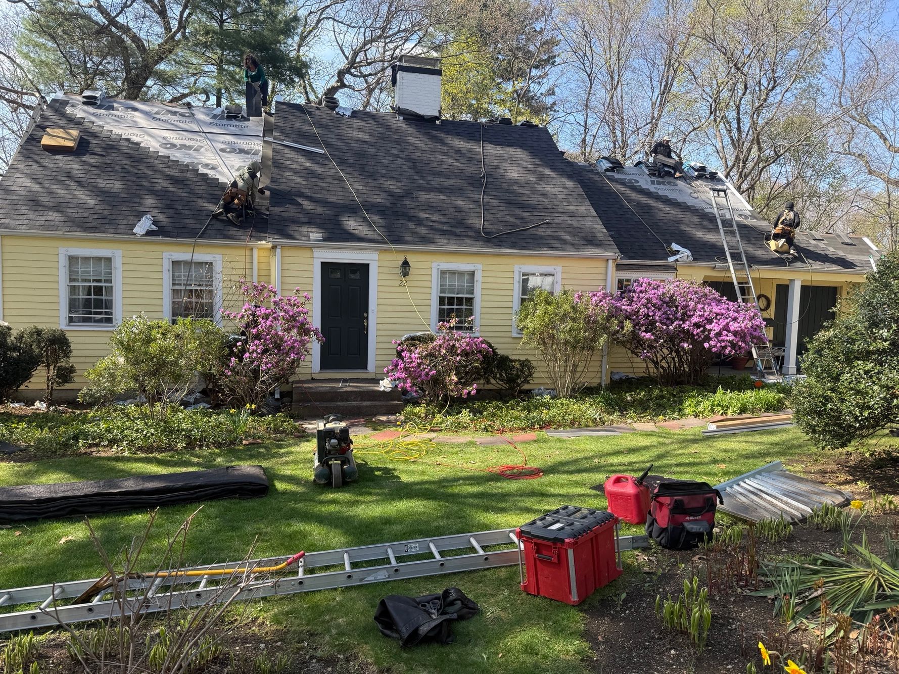 Installing premium ice and water shield leak barrier protection along the eaves of a Wellesley home before shingle installation.