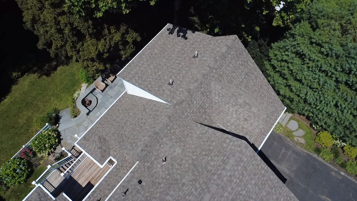 Side aerial view of Architectural Roof Replacement on estate home in Natick MA