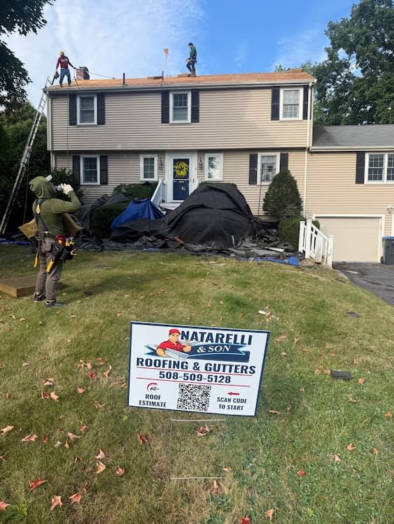 roofing crew installing new roof in natick ma