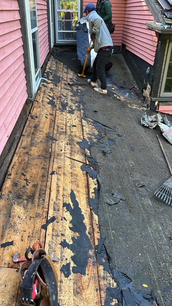 Tearing off old roof in Wayland MA