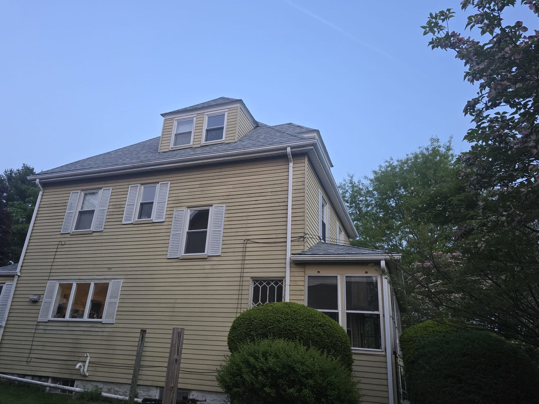 A newly completed premium asphalt shingle roof on a historic home within a Newton MA historical district