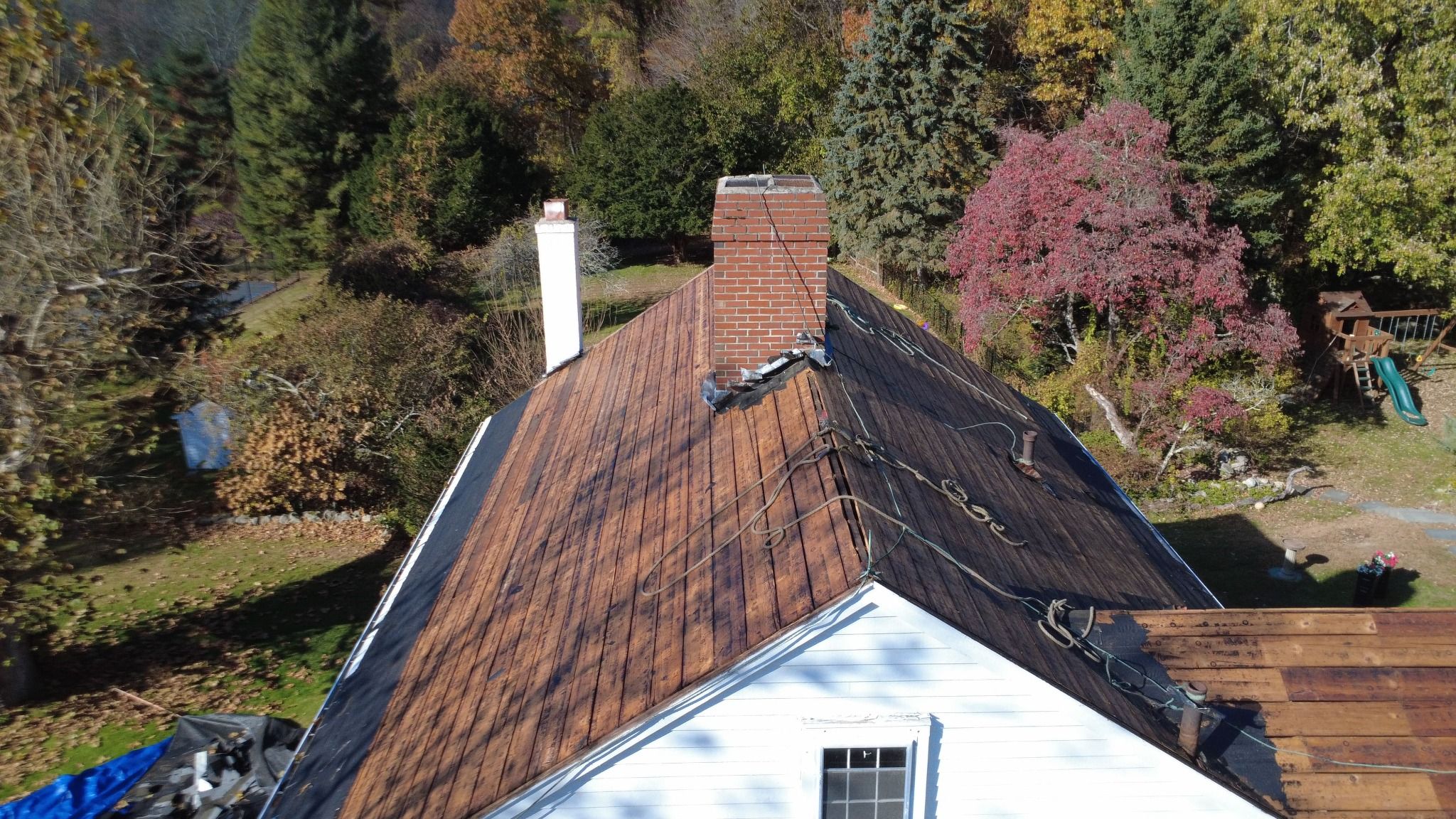 View of Chimney and roof line - roof replacement on historic Samuel Dunton House in Norfolk, Massachusetts Chimney and roof line - roof replacement on historic Samuel Dunton House in Norfolk, Massachusetts